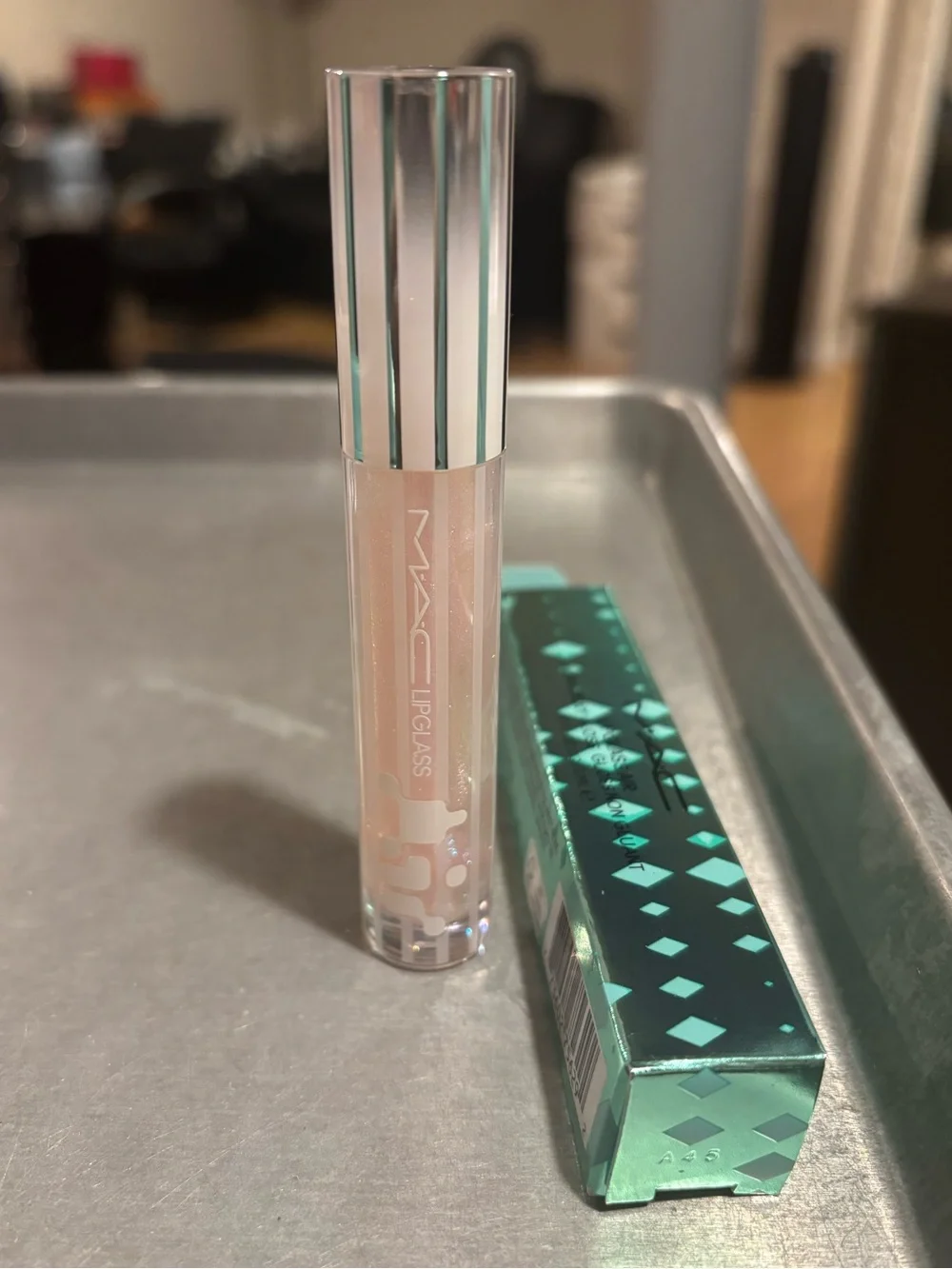 MAC Cosmetics Lipglass Gloss in shade Frozen a shimmery pink w blue reflect
